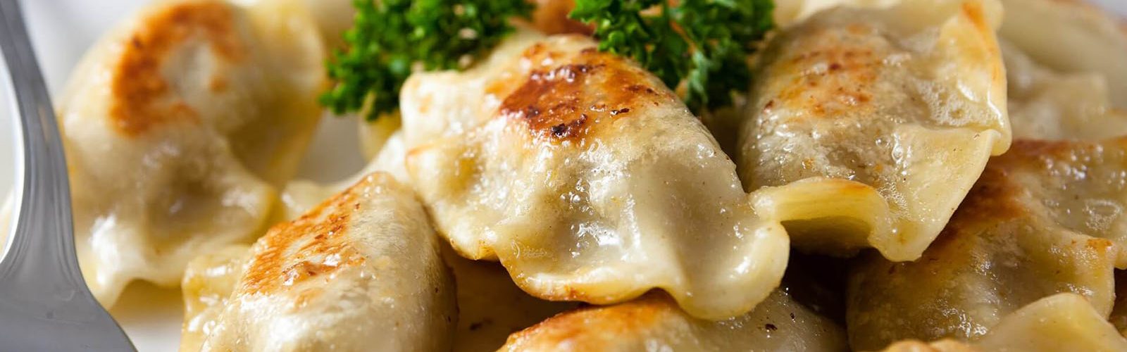 A photo of a plate of pierogi